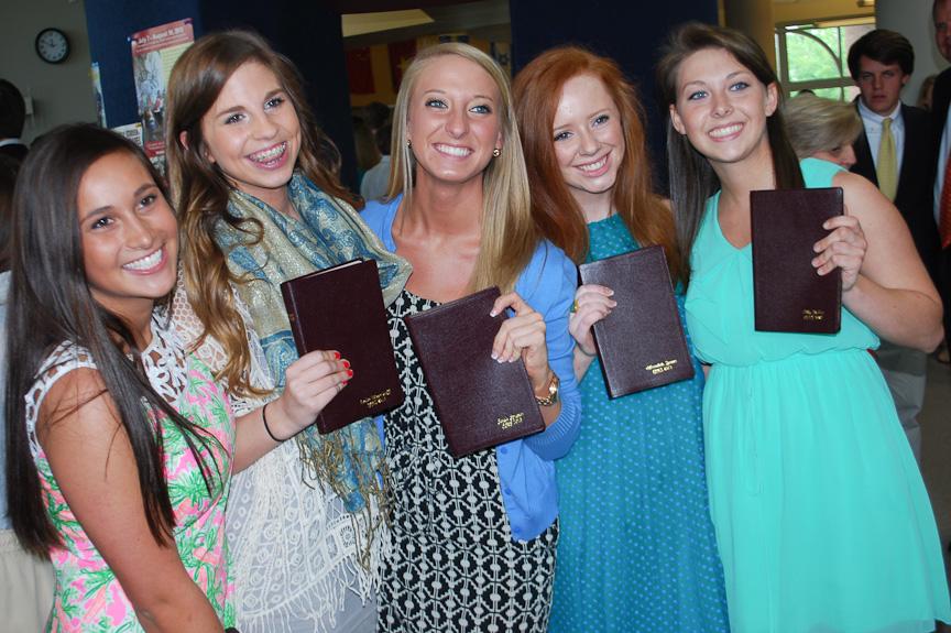 Seniors pose proudly with their Bibles