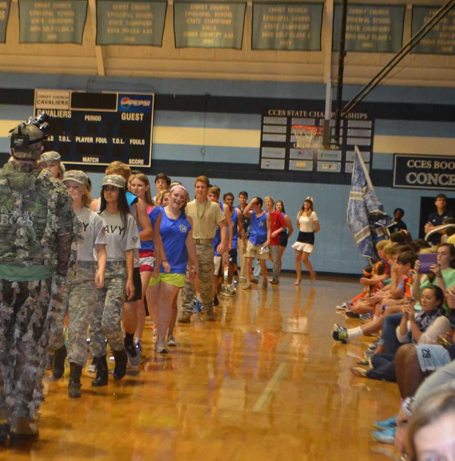 The Seniors enter the gym in uniform style.