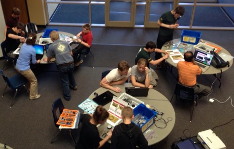 Students work together to build robots for the Robot Competition.