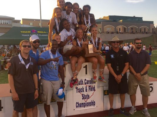 The girls celebrate their championship at Spring Valley High School last Saturday (Bob Castello/Greenville News).