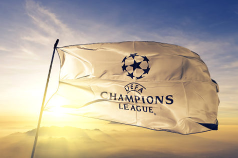 UEFA Champions League logo flag on flagpole textile cloth fabric waving on the top sunrise mist fog