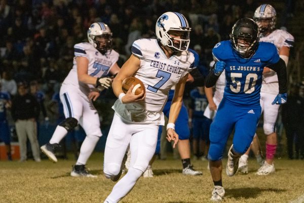 Quarterback Woods Windham rushing against St. Joes